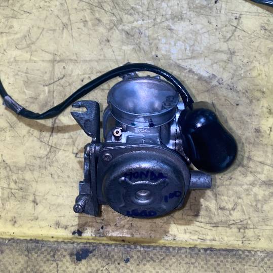Carburador Honda Lead 100. 2006.